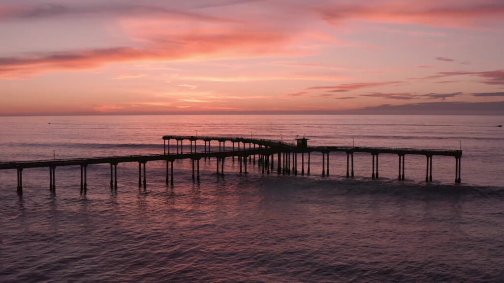 Calm pier at sunset used as reflective hero background